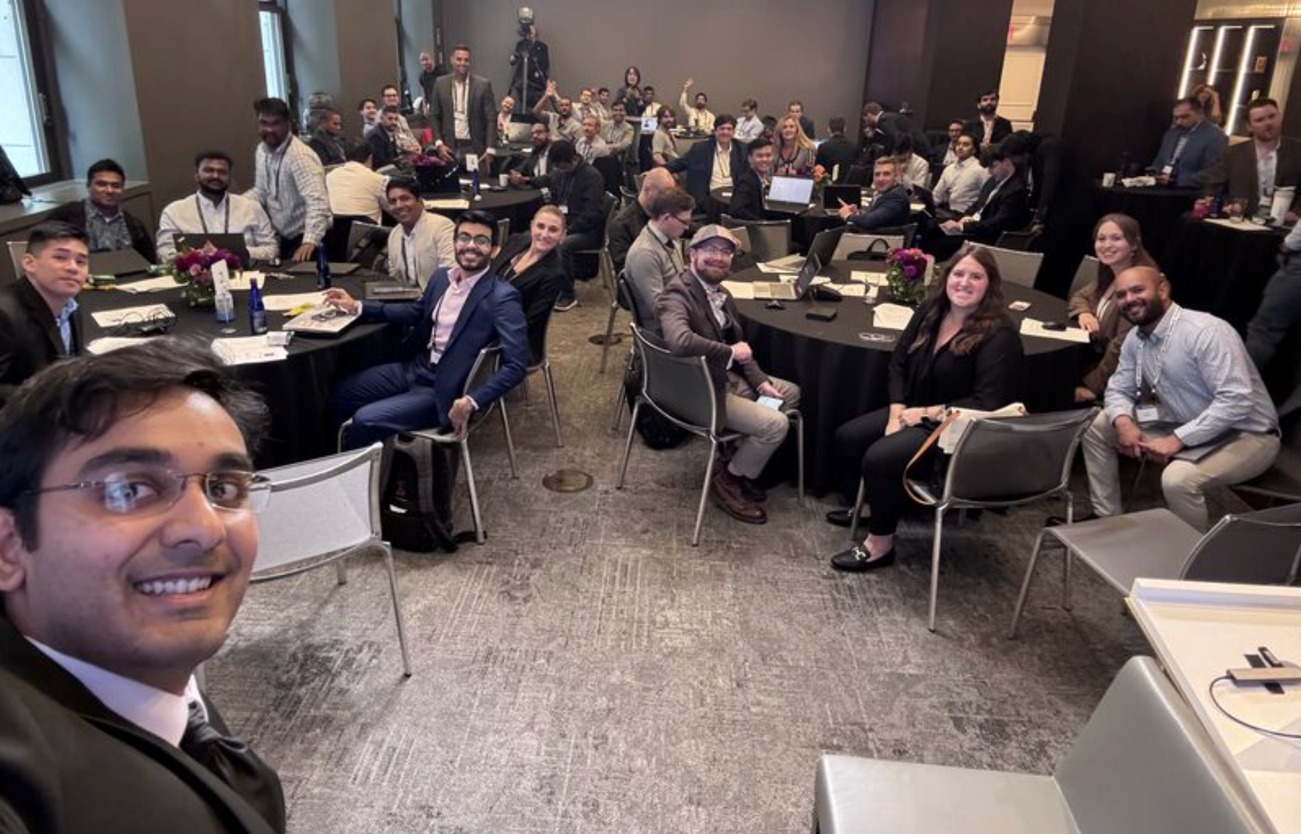 A group picture of smiling hackathon participants